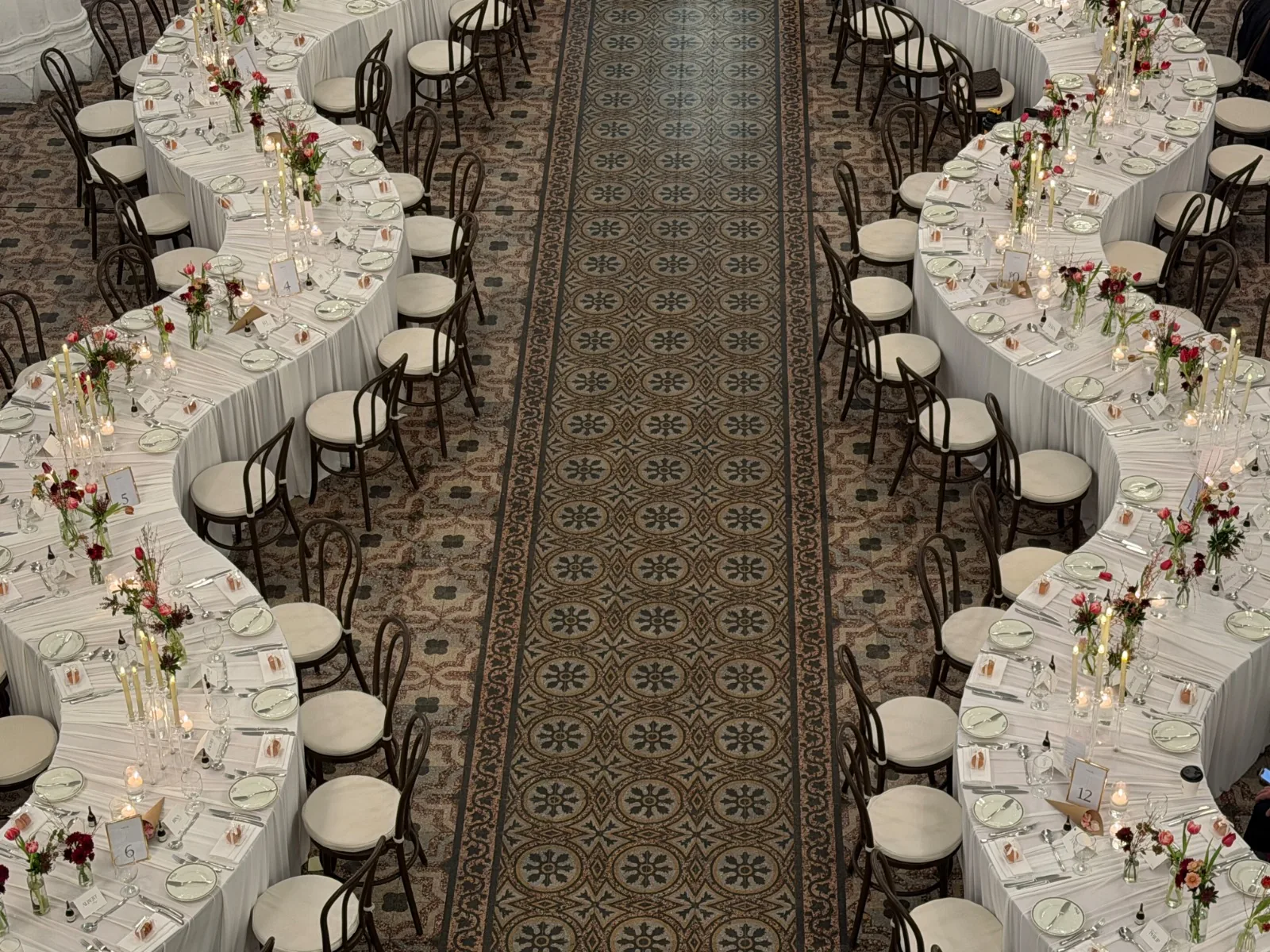 Real event setting with rows of chairs and dressed tables
